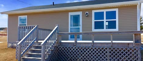 Front of cottage with large deck