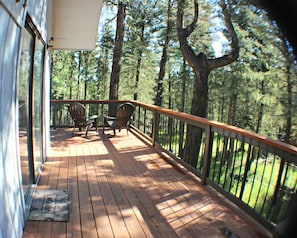 Reach the deck via sliding glass door through the dining room, or front stairs.