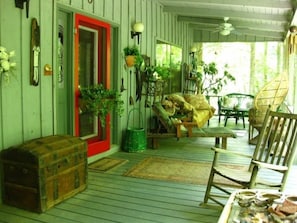 Covered Front Porch with Paddle Fans and a Cozy Atmosphere