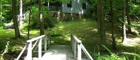 My Little Blue House sits on Woodring Branch in a Park Setting.