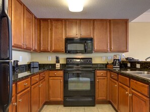 Fully stocked kitchen with full size appliances.