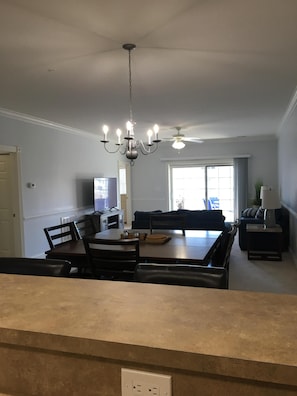 Dining rm table and living rm, view from kitchen 