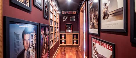 Hallway to the theater lined with movie posters.