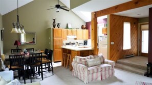 Contemporary style kitchen and living room set up at Forest Rim Condo in the Heart of Waterville Valley, NH