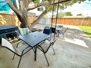 Two patio tables and plenty of chairs give you options on where to lounge