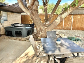 Enjoy our outdoor TV while lounging in our hot tub or in our patio furniture