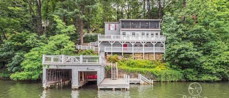 View of the Enchanted Cottage from the lake. (The boat house is currently under repair.)