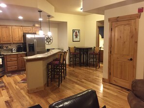 Lower floor kitchen with view of downstairs bathroom