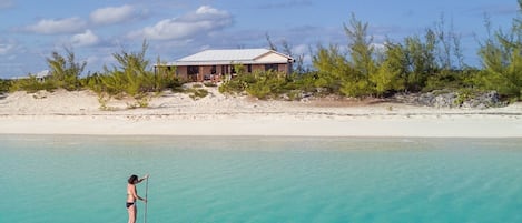 Paddle boarding in front of Sundance Beach House.