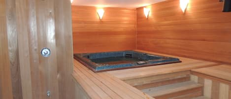 Relax in the comfort of a private, indoor hot tub in a cedar lined spa