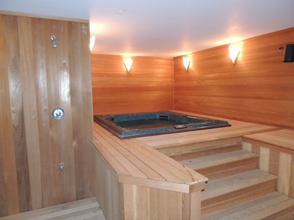 Relax in the comfort of a private, indoor hot tub in a cedar lined spa