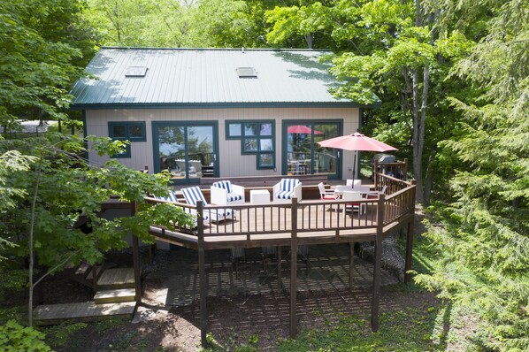 Large deck provides expansive outdoor living overlooking beautiful Walloon Lake