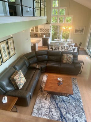 Open concept living room w/ power reclining sectional for comfortable relaxation