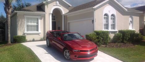 Front, tiled driveway for two vehicles, more spaces available on the street