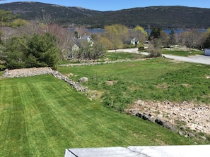 View from your deck of our lovely landscaped yard, Somes Sound and mountains