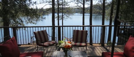 Sit, relax, and enjoy the beautiful view of Lake Combie from the cottage deck