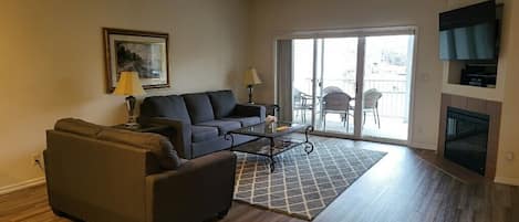 Living room with Wide Screen TV, Cable, Fireplace, view, queen Hide-a-bed.