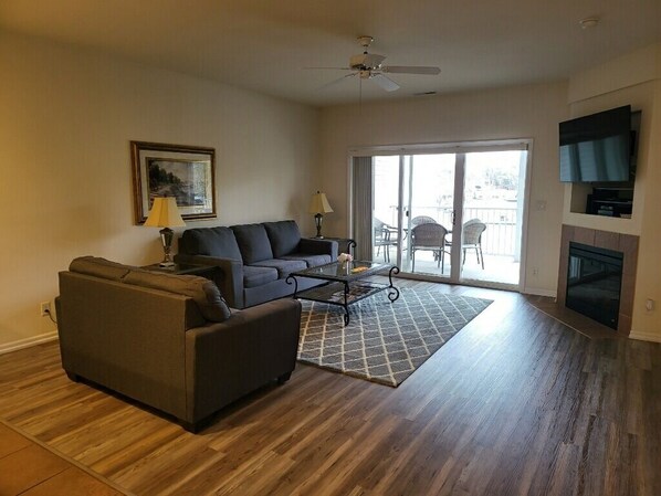 Living room with Wide Screen TV, Cable, Fireplace, view, queen Hide-a-bed.