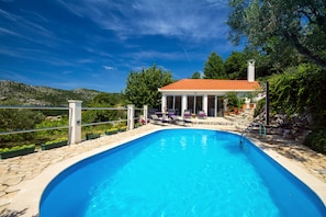 Heated pool with relaxing area