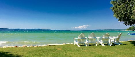 Stunning Torch Lake! This cottage has nearly 200 feet of soft sandy beach