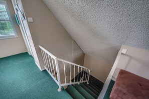 Loft stairs with lake water green carpet! How fun!