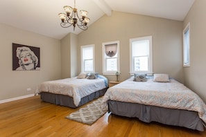 Spacious bedroom with two queen size beds and en-suite bathroom