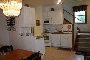 Kitchen w/dishwasher, refrigerator, microwave, stove, washer/dryer, w/ detergent