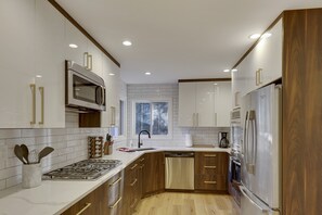 Chef's kitchen with large counter area with  double oven