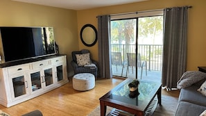 Bright and open sitting area with 65" 3D TV