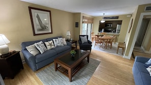 A bright open family room with a sleeper sofa for extra guests