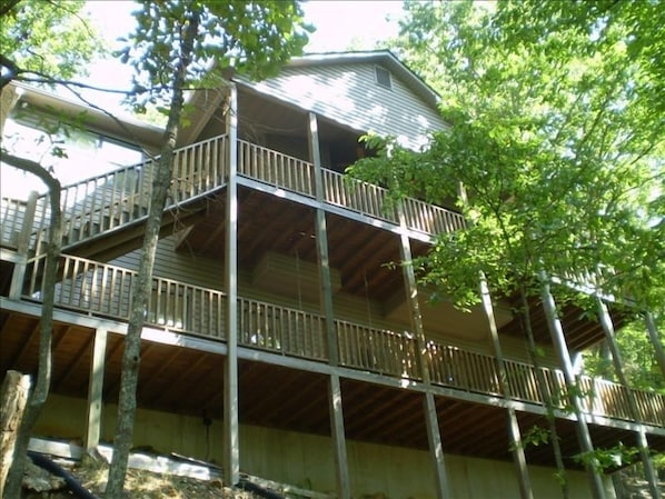 View of the house looking up from the trail below.