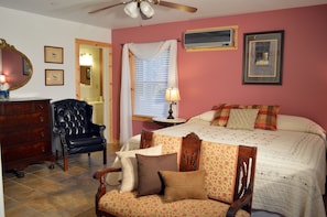 East Bedroom w/king size bed, private full bath, ceiling fan & climate control.