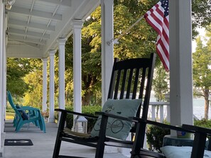The porch overlooks the lake, protects you from the rain and has a ceiling fan.