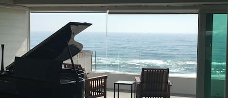 enjoy playing piano to the ocean at sunset