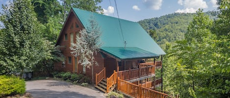 A View Of This Beautiful Cabin With A Half Moon Shaped Driveway For Easy Access!