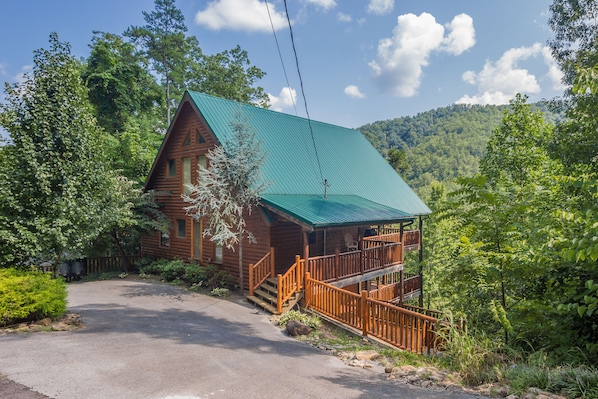 A View Of This Beautiful Cabin With A Half Moon Shaped Driveway For Easy Access!