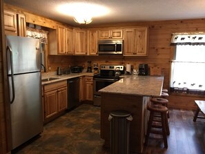 Beautiful Fully Stocked Kitchen With Granite Counter Tops, & 4 Bar Stools.