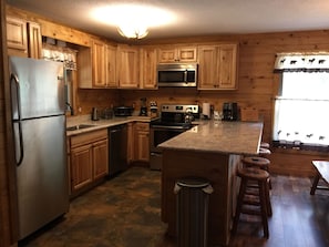 Beautiful Fully Stocked Kitchen With Granite Counter Tops, & 4 Bar Stools.