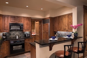 Cook up a storm in the full kitchen, and enjoy your very own wet bar!