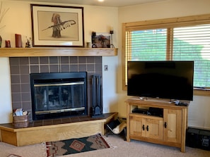 Living room -Fireplace, flat screen TV and beautiful view of Mt. Crested Butte