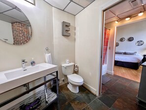 Full jack and jill restroom with shower stall.