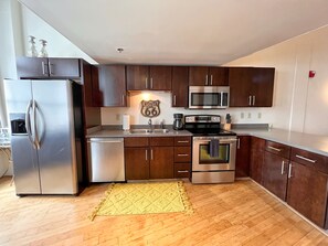 Full kitchen with standard coffee maker.