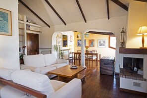 Living room with fire place and dining area