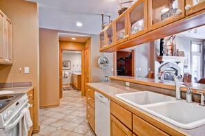 Kitchen view toward foyer, master bath