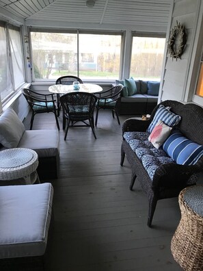 Beautiful wrap-around porch with 2 seating areas and dining area