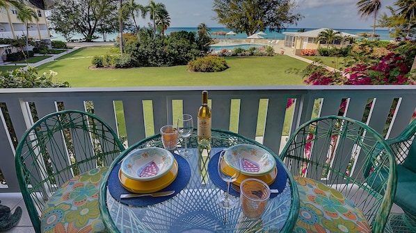 Your balcony overlooks well-maintained grounds and a heated swimming pool.