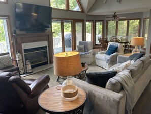 Cozy living room with with new furniture and spectacular views of the lake