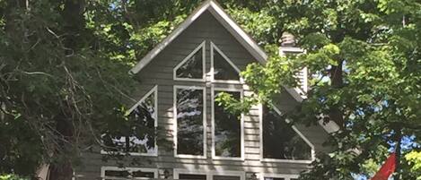 Shaded under mature oaks with large windows to feel the morning sun