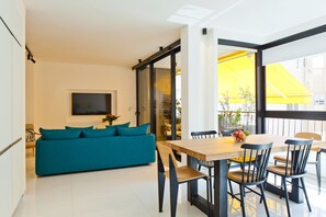 View of the dining area and a living room in Tel Aviv apartment 