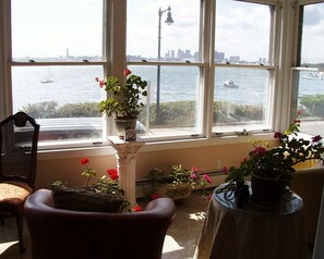 Sunroom overlooking harbor and Boston skyline